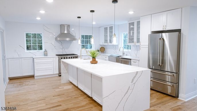 Interior, Kitchen, Marble Walls, Pendant Lights, Recessed Lighting, Stainless Steel Appliances, Wood Texture Flooring