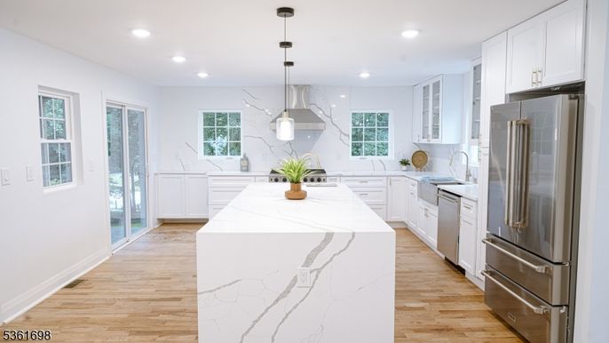 Interior, Kitchen, Marble Walls, Pendant Lights, Recessed Lighting, Stainless Steel Appliances, Wood Texture Flooring