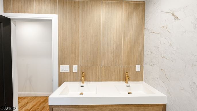 Bathroom, Dual Sink Vanities, Interior, Marble Walls, Wood Texture Flooring