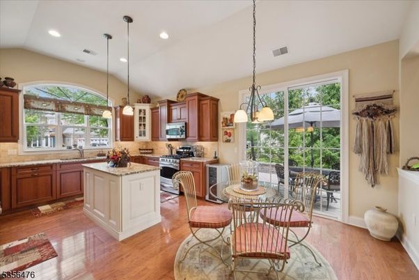Dining room, Interior, Kitchen, Pendant Lights, Recessed Lighting, Stainless Steel Appliances, Wood Texture Flooring