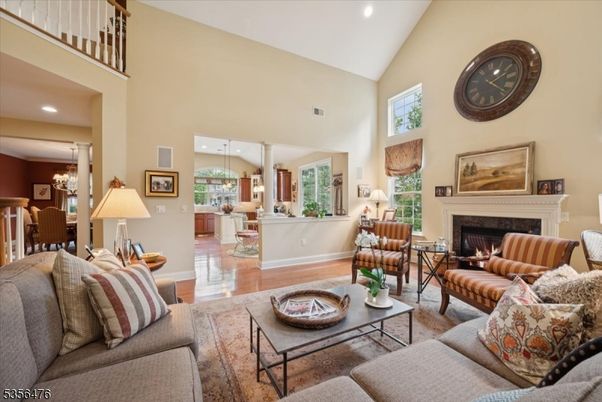 Chandelier, Dining room, Fireplace, Interior, Living room, Pendant Lights, Recessed Lighting, Wood Texture Flooring