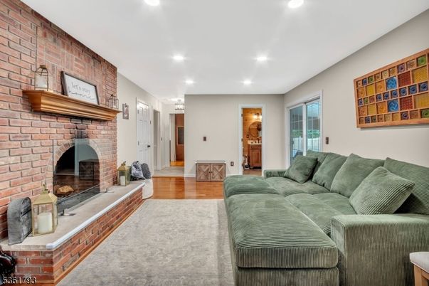 Fireplace, Interior, Living room, Recessed Lighting, Stone Walls, Wood Texture Flooring