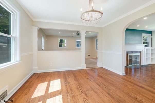 Chandelier, Empty room, Fireplace, Interior, Recessed Lighting, Wood Texture Flooring