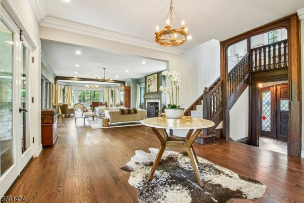 Chandelier, Fireplace, Interior, Living room, Pendant Lights, Recessed Lighting, Wood Texture Flooring