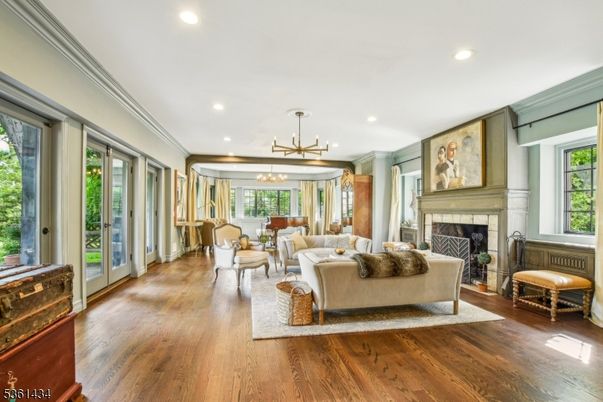 Dining room, Fireplace, Interior, Living room, Pendant Lights, Recessed Lighting, Wood Texture Flooring