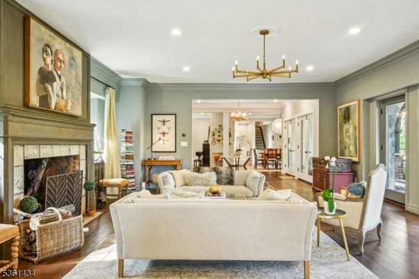 Chandelier, Dining room, Fireplace, Interior, Living room, Pendant Lights, Recessed Lighting, Wood Texture Flooring