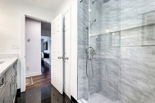 Bathroom, Glass Shower, Interior, Marble Walls, Wood Texture Flooring