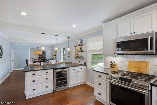Dining room, Interior, Kitchen, Pendant Lights, Recessed Lighting, Stainless Steel Appliances, Wood Texture Flooring