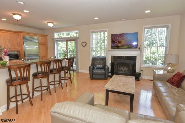 Fireplace, Interior, Kitchen, Living room, Recessed Lighting, Stainless Steel Appliances, Wood Texture Flooring