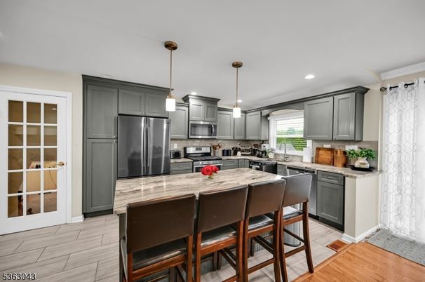 Interior, Kitchen, Pendant Lights, Recessed Lighting, Stainless Steel Appliances, Wood Texture Flooring