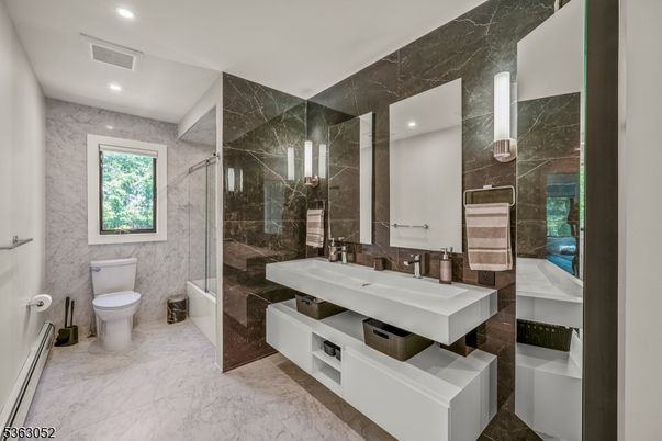 Bathroom, Dual Sink Vanities, Glass Shower, Interior, Marble, Marble Walls, Recessed Lighting