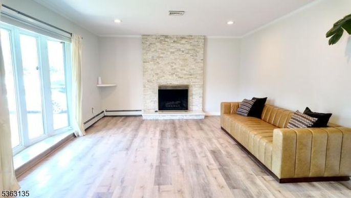 Empty room, Fireplace, Interior, Recessed Lighting, Stone Walls, Wood Texture Flooring