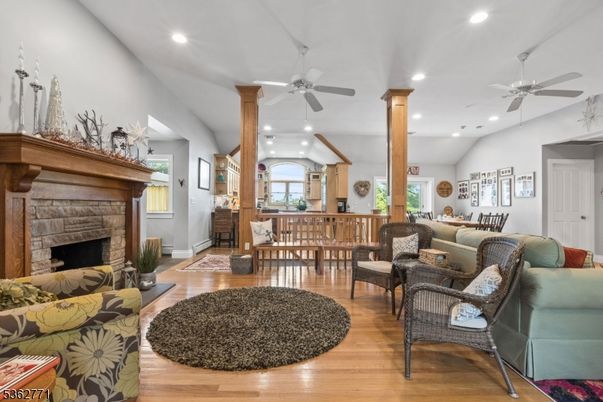 Dining room, Fireplace, Interior, Living room, Recessed Lighting, Wood Texture Flooring
