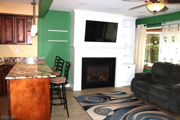 Dining room, Fireplace, Interior, Pendant Lights, Wood Texture Flooring