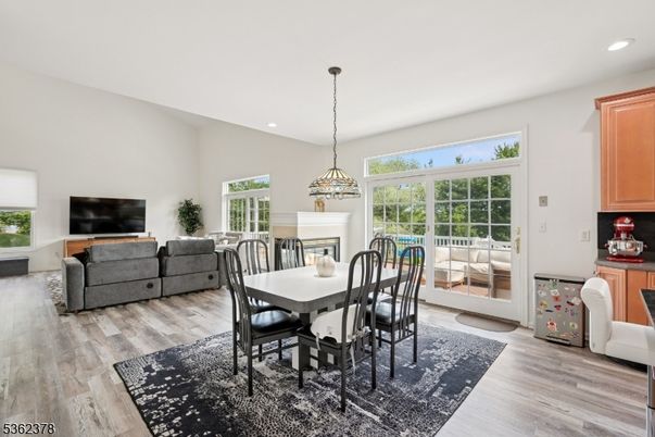 Dining room, Fireplace, Interior, Living room, Pendant Lights, Recessed Lighting, Wood Texture Flooring