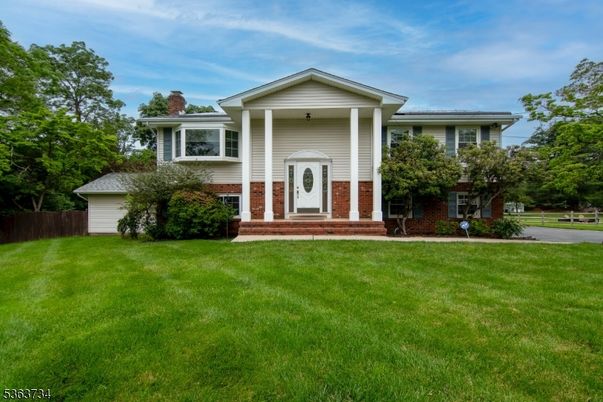 Backyard, Exterior, Facade, Brick Facade, Raised Ranch