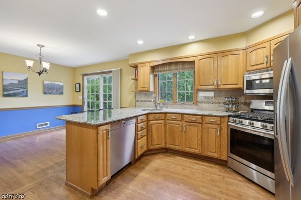 Chandelier, Interior, Kitchen, Recessed Lighting, Stainless Steel Appliances, Wood Texture Flooring