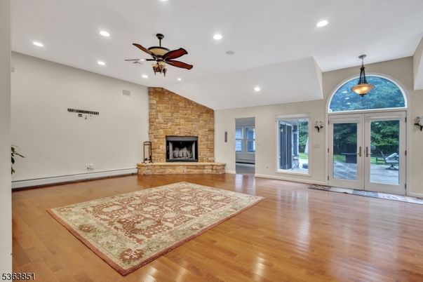 Empty room, Fireplace, Interior, Pendant Lights, Recessed Lighting, Stone Walls, Wood Texture Flooring