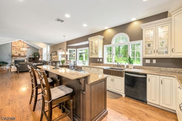 Dining room, Fireplace, Interior, Kitchen, Living room, Pendant Lights, Recessed Lighting, Stone Walls, Wood Texture Flooring