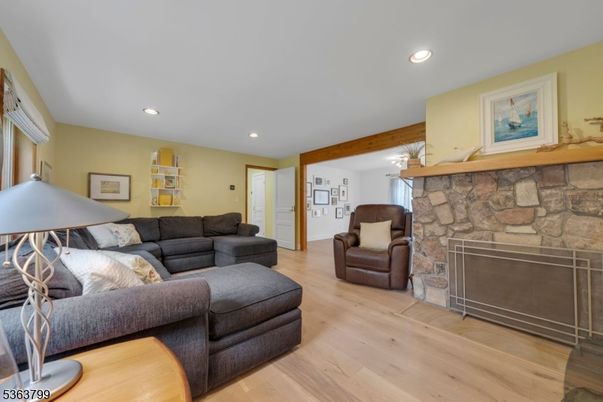 Fireplace, Interior, Living room, Recessed Lighting, Stone Walls, Wooden Beams, Wood Texture Flooring