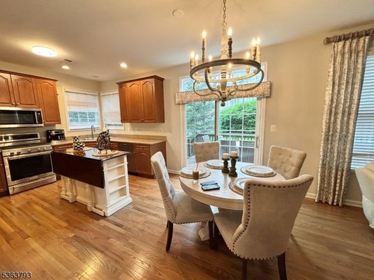 Chandelier, Dining room, Interior, Kitchen, Recessed Lighting, Stainless Steel Appliances, Wood Texture Flooring