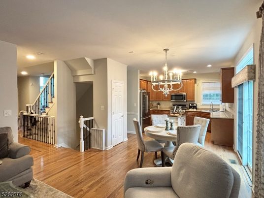 Chandelier, Dining room, Interior, Kitchen, Recessed Lighting, Stainless Steel Appliances, Wood Texture Flooring