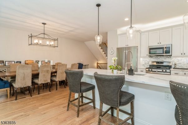 Dining room, Interior, Kitchen, Pendant Lights, Recessed Lighting, Stainless Steel Appliances, Wood Texture Flooring