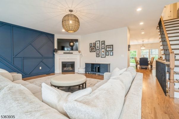 Chandelier, Dining room, Fireplace, Interior, Living room, Pendant Lights, Recessed Lighting, Wood Texture Flooring