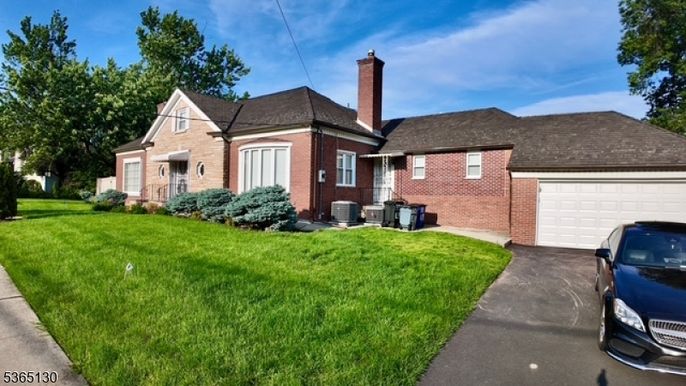 Attached, Backyard, Exterior, Facade, Brick Facade, Cape Cod