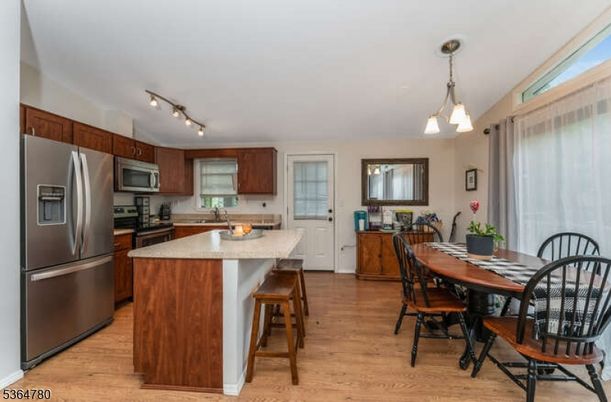 Dining room, Interior, Kitchen, Pendant Lights, Stainless Steel Appliances, Wood Texture Flooring
