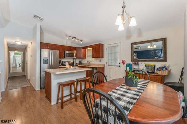 Dining room, Interior, Kitchen, Pendant Lights, Stainless Steel Appliances, Wood Texture Flooring