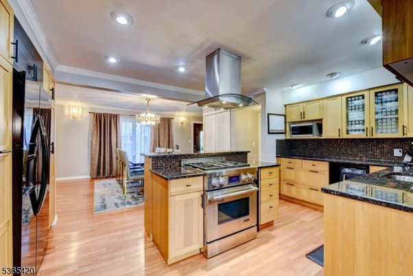 Chandelier, Dining room, Interior, Kitchen, Recessed Lighting, Stainless Steel Appliances, Wood Texture Flooring