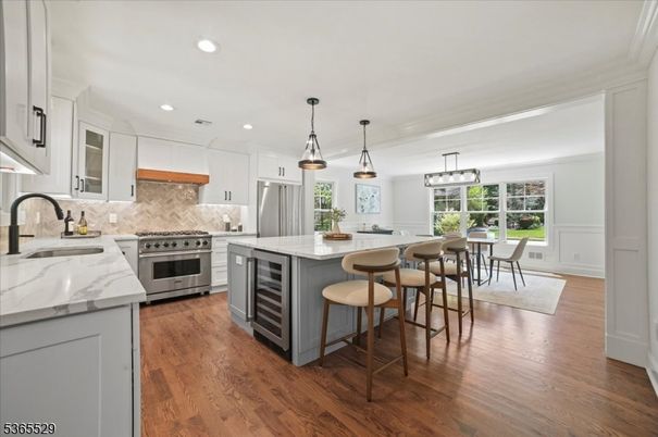 Dining room, Interior, Kitchen, Pendant Lights, Recessed Lighting, Stainless Steel Appliances, Wood Texture Flooring