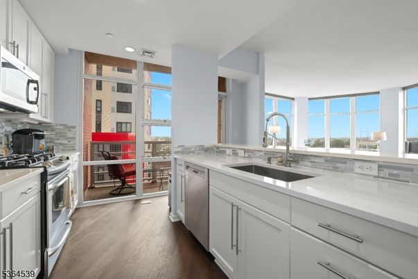 Interior, Kitchen, Recessed Lighting, Stainless Steel Appliances, Water, Wood Texture Flooring