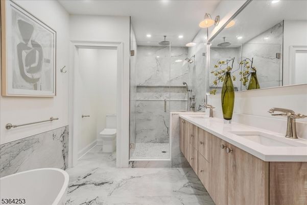 Bathroom, Dual Sink Vanities, Free Standing Baths, Glass Shower, Interior, Marble, Marble Walls, Recessed Lighting