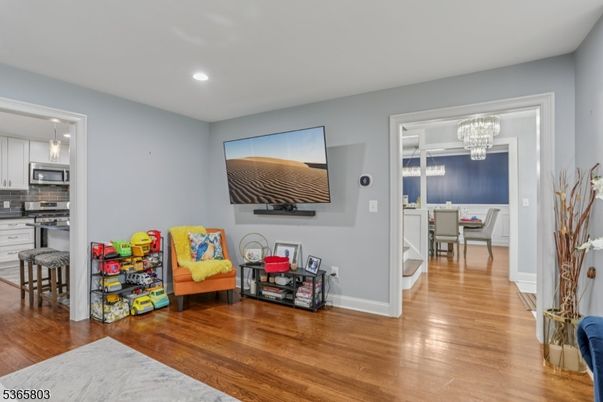 Chandelier, Dining room, Interior, Kitchen, Recessed Lighting, Stainless Steel Appliances, Wood Texture Flooring