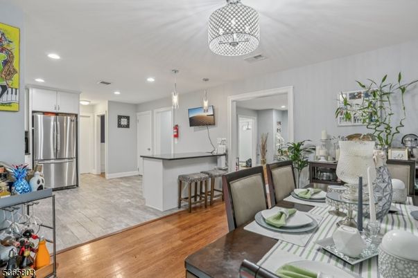 Dining room, Interior, Kitchen, Pendant Lights, Recessed Lighting, Stainless Steel Appliances, Wood Texture Flooring