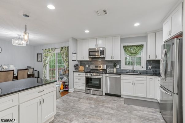 Dining room, Interior, Kitchen, Pendant Lights, Recessed Lighting, Stainless Steel Appliances, Wood Texture Flooring