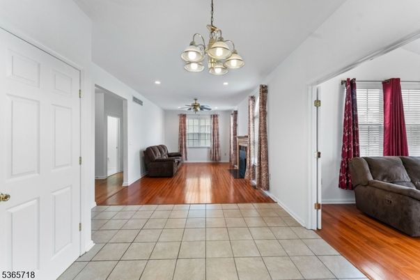 Chandelier, Fireplace, Interior, Recessed Lighting, Wood Texture Flooring