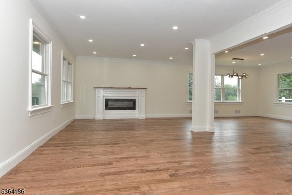 Empty room, Fireplace, Interior, Pendant Lights, Recessed Lighting, Wood Texture Flooring