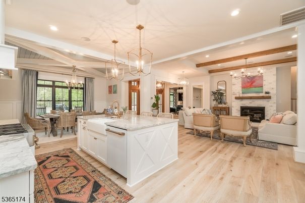 Chandelier, Dining room, Fireplace, Interior, Kitchen, Living room, Pendant Lights, Recessed Lighting, Wooden Beams, Wood Texture Flooring
