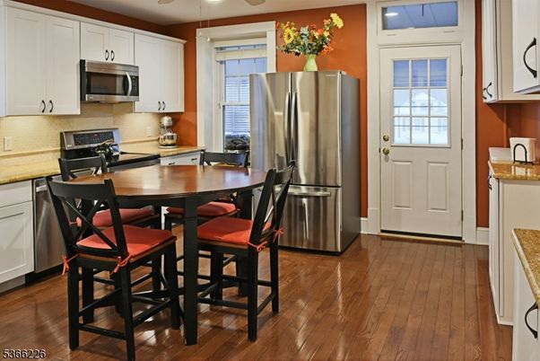 Dining room, Interior, Kitchen, Recessed Lighting, Stainless Steel Appliances, Wood Texture Flooring