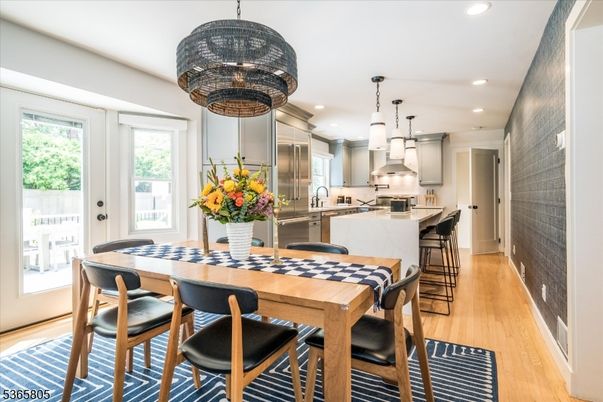 Dining room, Interior, Kitchen, Pendant Lights, Recessed Lighting, Stainless Steel Appliances, Wood Texture Flooring