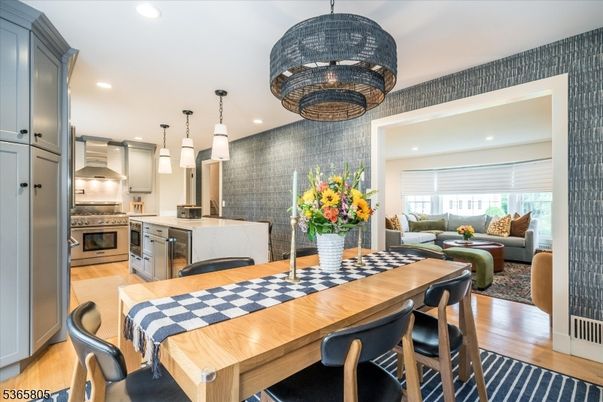 Dining room, Interior, Kitchen, Living room, Pendant Lights, Recessed Lighting, Stainless Steel Appliances, Wood Texture Flooring