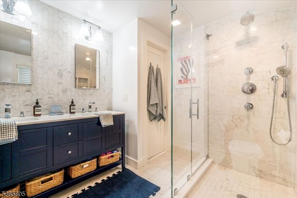 Bathroom, Dual Sink Vanities, Glass Shower, Interior, Marble Walls, Recessed Lighting