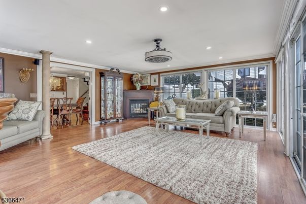 Dining room, Fireplace, Interior, Living room, Recessed Lighting, Wood Texture Flooring