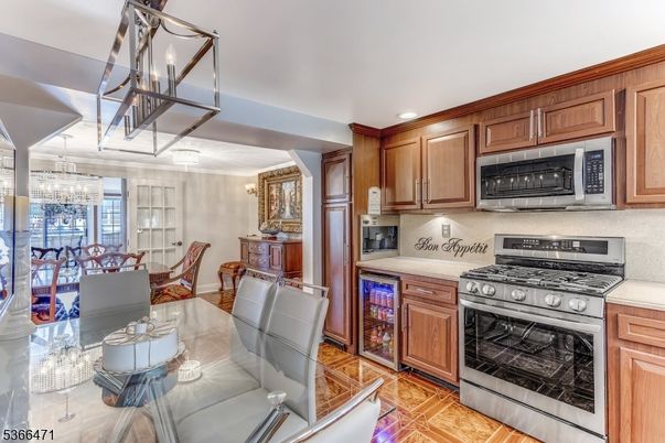 Chandelier, Dining room, Interior, Kitchen, Recessed Lighting, Stainless Steel Appliances, Wood Texture Flooring