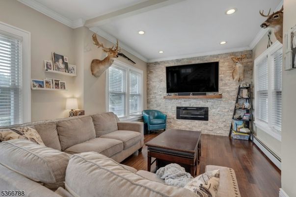 Fireplace, Interior, Living room, Recessed Lighting, Stone Walls, Wood Texture Flooring