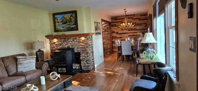 Chandelier, Dining room, Fireplace, Interior, Living room, Wood Texture Flooring, Wooden Walls