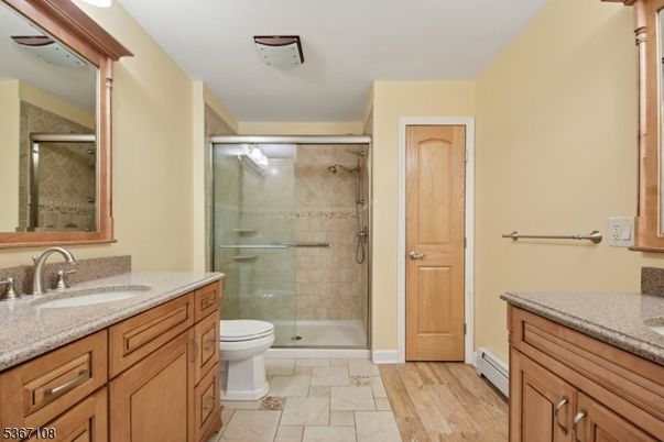 Bathroom, Dual Sink Vanities, Glass Shower, Interior, Wood Texture Flooring